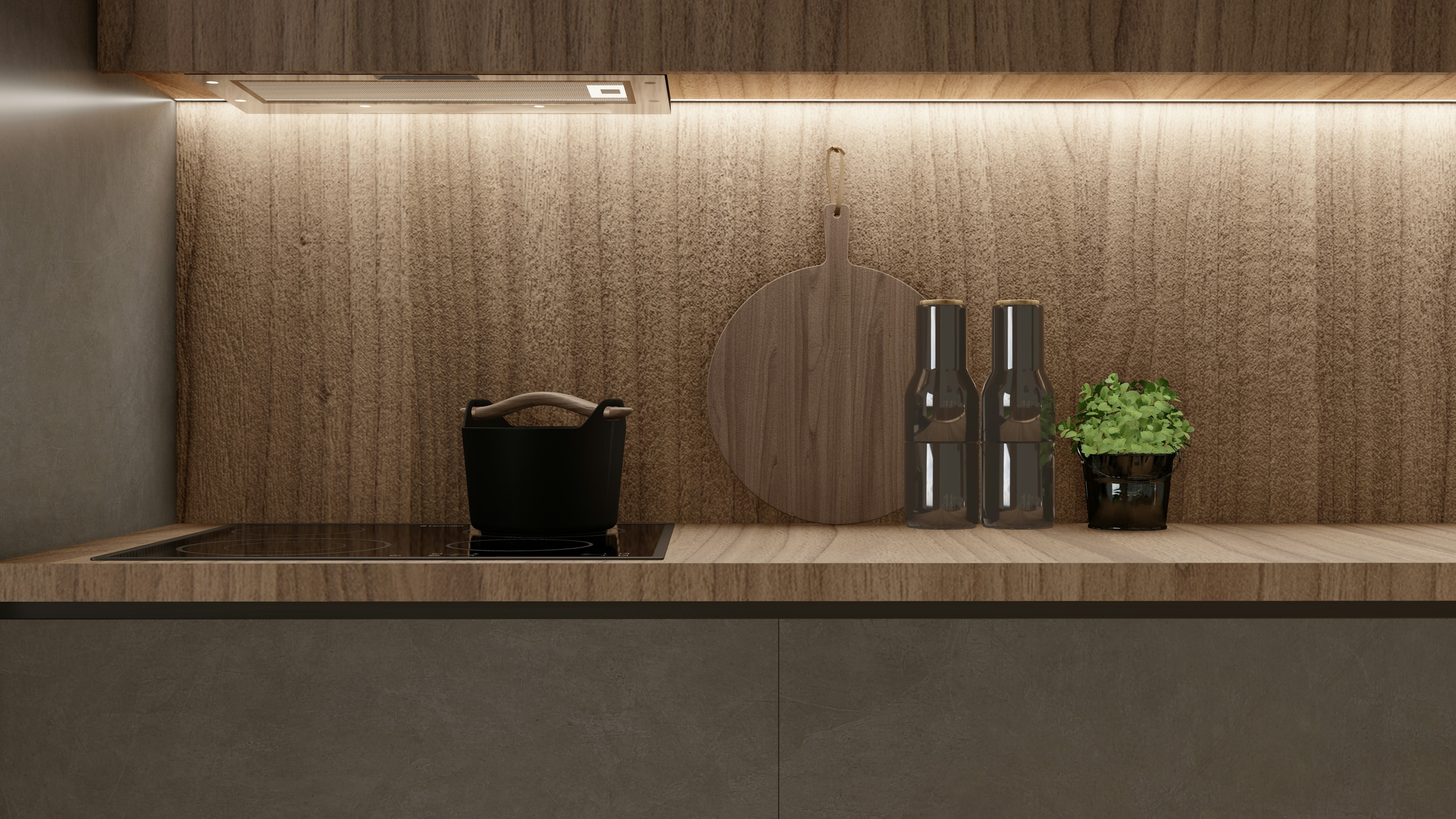 Kitchen island in warm oak with a stone worktop and concealed lighting beneath the upper run.