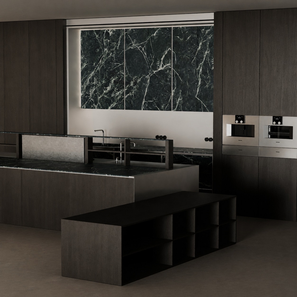 A dark oak kitchen with a black veined marble backsplash, integrated ovens and a long island with a built-in hob.