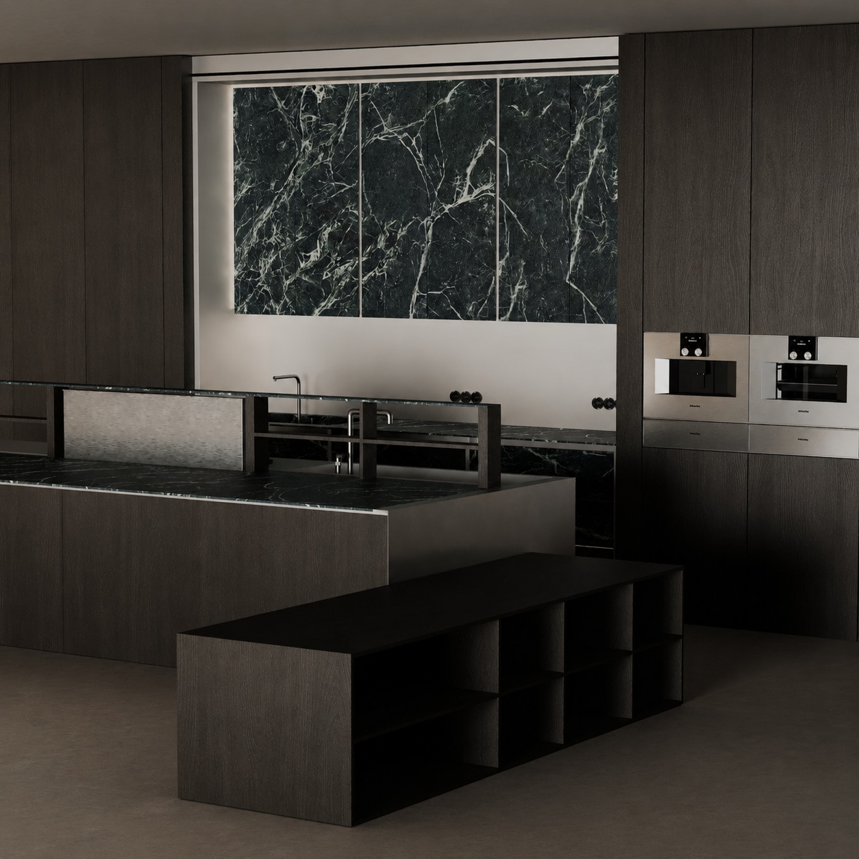 A dark oak kitchen with a black veined marble backsplash, integrated ovens and a long island with a built-in hob.