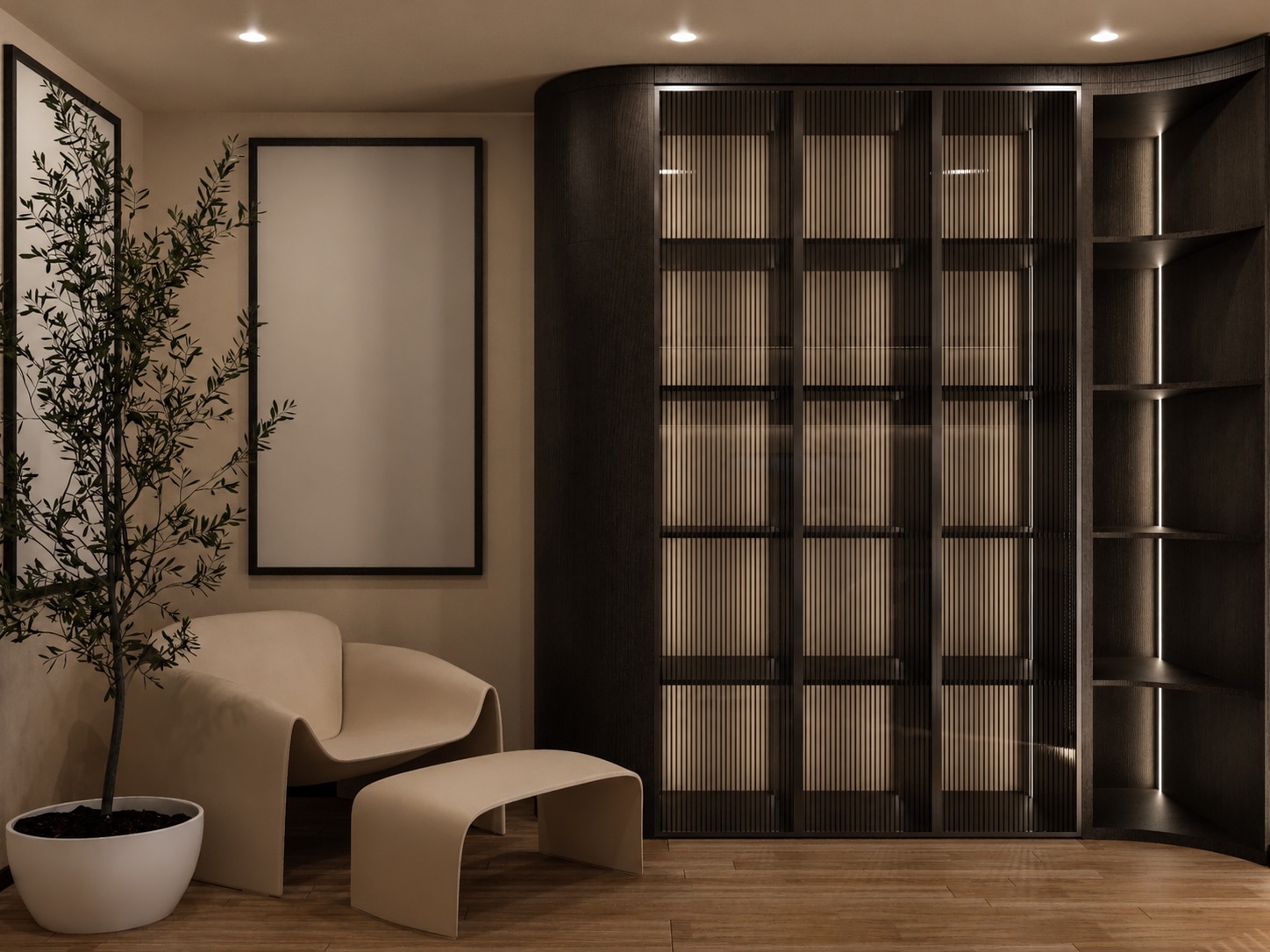 A tall curved cabinet with backlit display shelving beside a cream lounge chair, ottoman and olive tree.